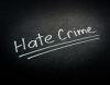 White text reading "Hate Crime" on a black background